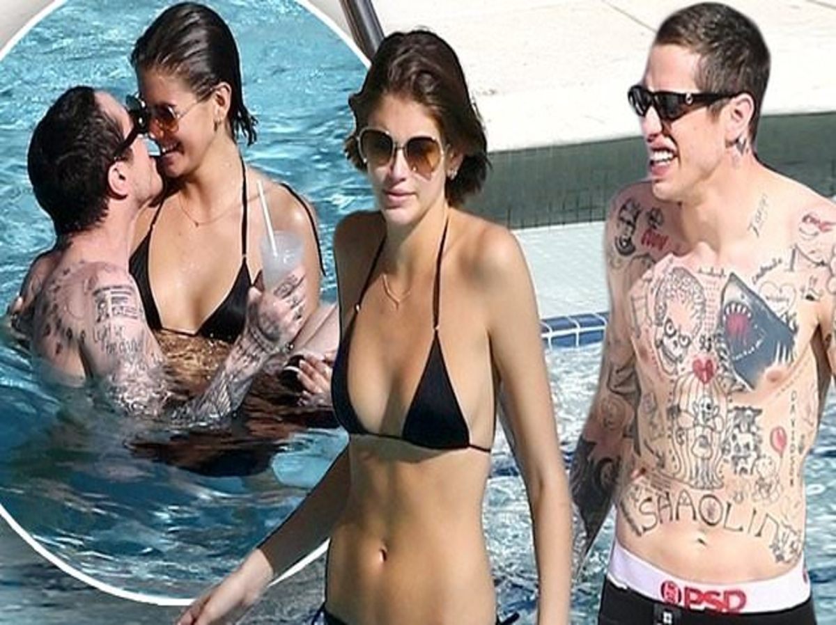 Kaia Gerber and Pete Davidson sharing a tender moment by the pool in Miami Beach, Florida.