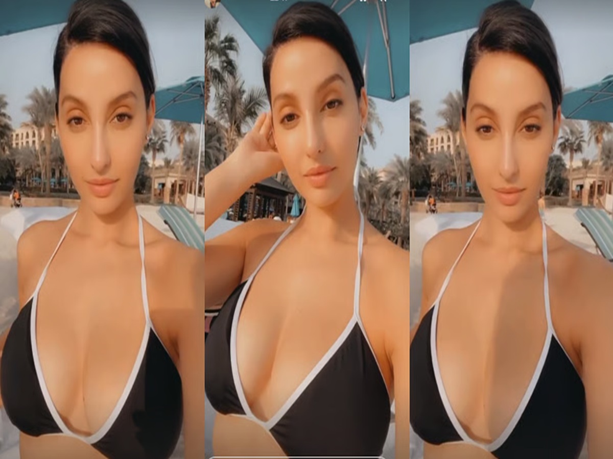 Nora Fatehi flaunting her toned figure in a black and white bikini under the Dubai sun