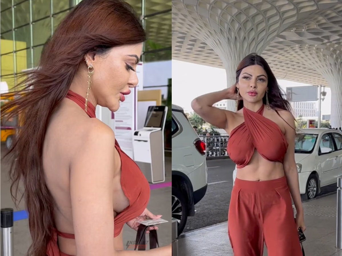 Sherlyn Chopra wearing a bold red outfit, showcasing her confident and glamorous persona