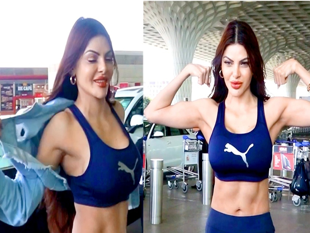 Sherlyn Chopra removing her jacket in a bold fashion moment, setting the temperature high with her confident pose