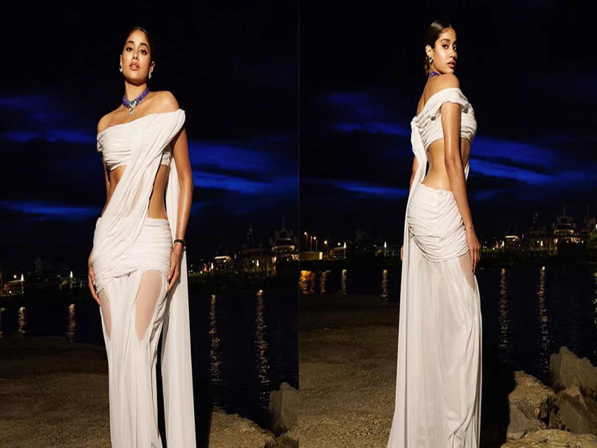 Janhvi Kapoor wearing amethyst and emerald jewelry with her white saree at Cannes 2025