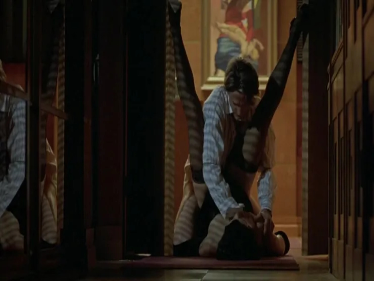 Scene from Damage featuring Jeremy Irons in a tense moment, highlighting the film's themes of love, betrayal, and emotional turmoil.