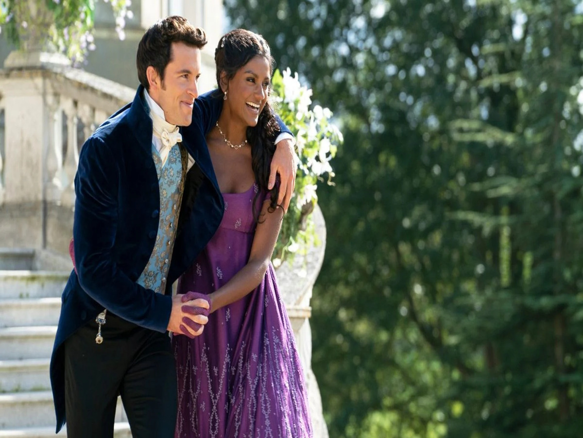 Kate Sharma (Ashley) and Viscount Anthony Bridgerton (Bailey) sharing a charged moment in a heated exchange, showcasing their intense enemies-to-lovers chemistry.