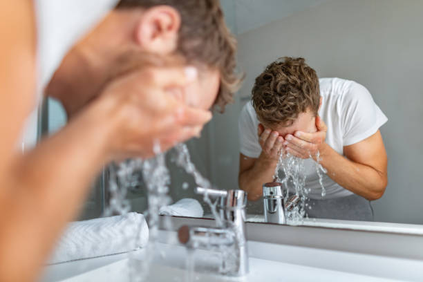 Person washing hands with soap to maintain eye hygiene and prevent infections