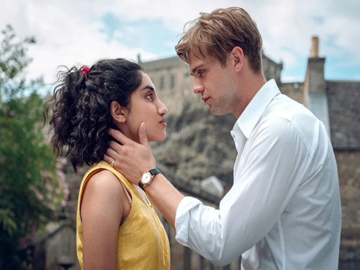 Emma (Mod) and Dexter (Woodall) sharing a poignant moment in "One Day," illustrating their deep connection through years of friendship and romantic tension.