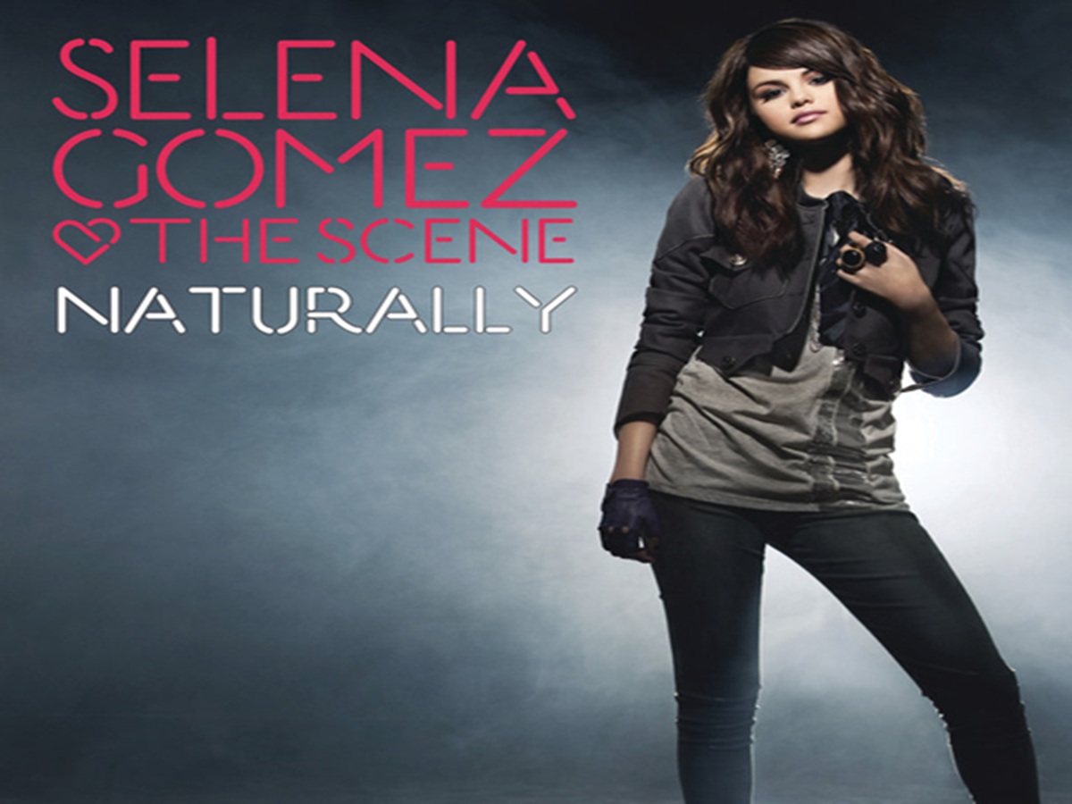 Selena Gomez posing confidently on the single cover for “Naturally” amid vibrant, colorful graphics