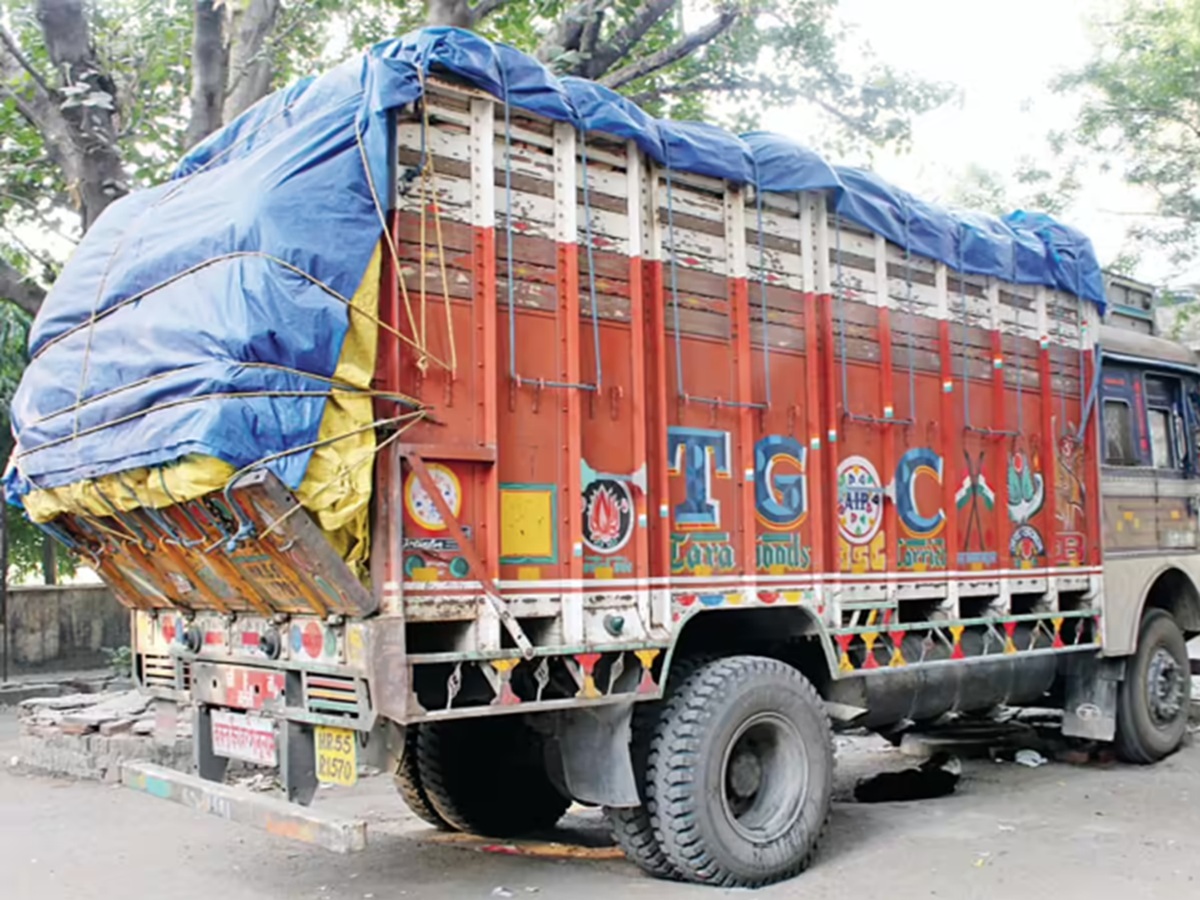 Overloaded truck with worn tires on a highway