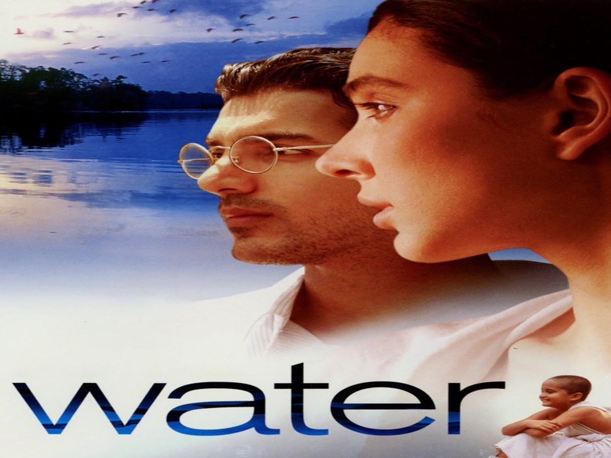 A young widow in traditional attire gazes longingly across the river in Water.