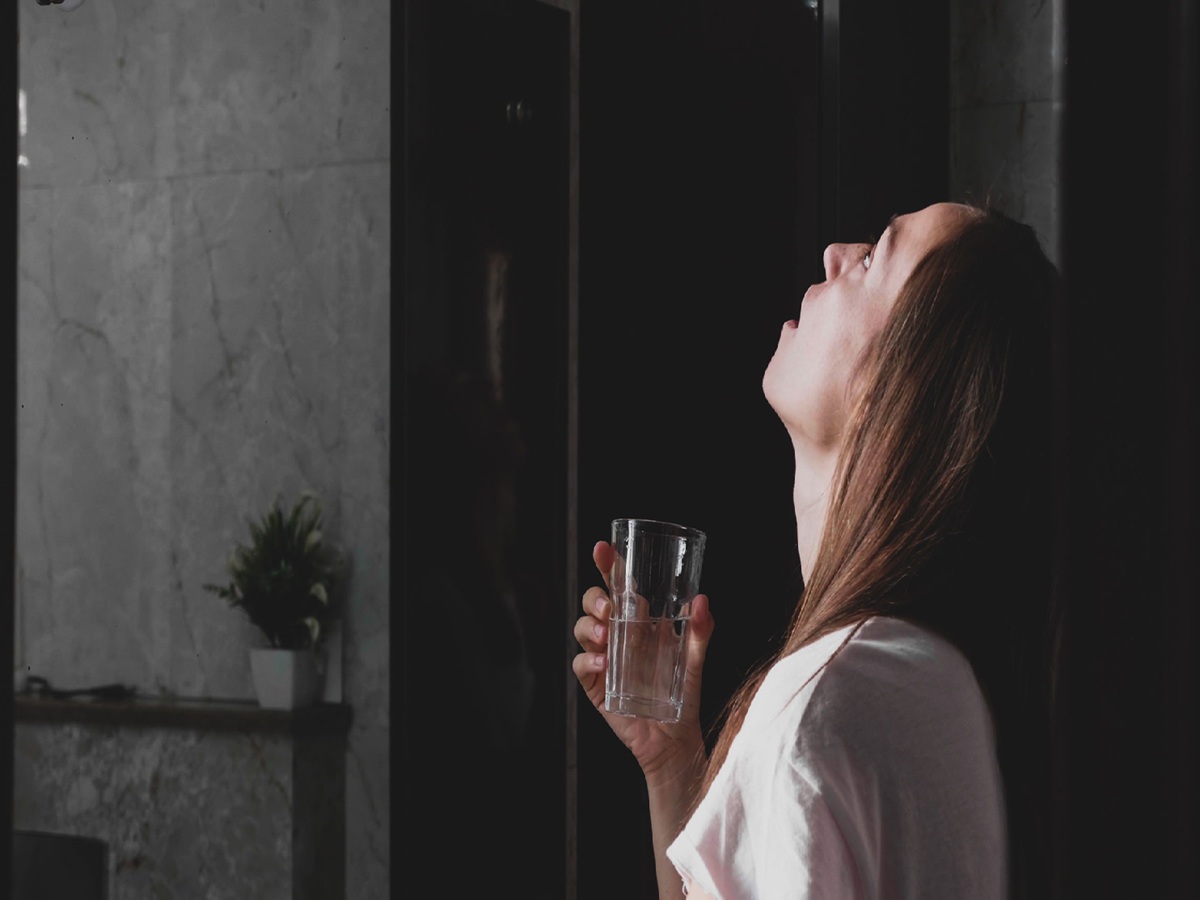 Glass of warm salt water for gargling