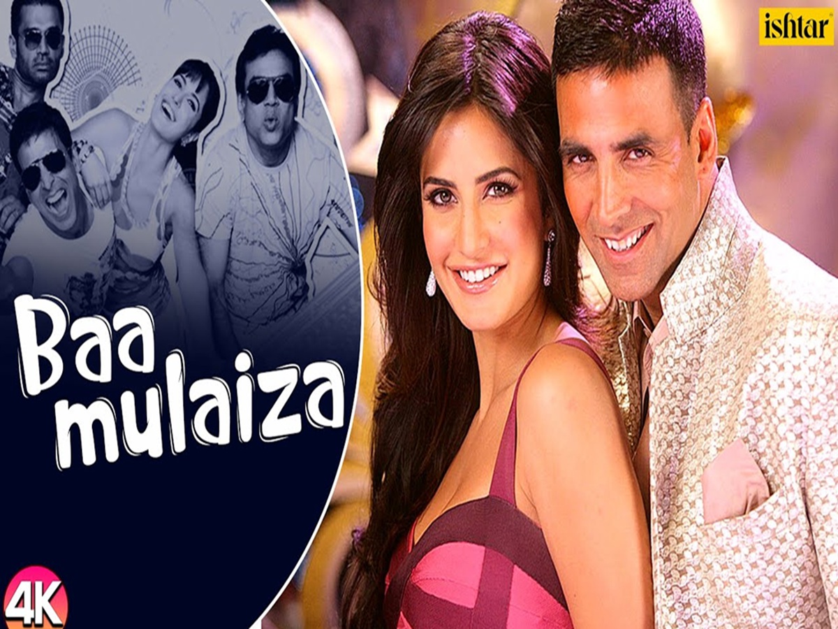 Film still showing Mallika Sherawat and cast in a vibrant dance pose from the song “Aaj Mood Hai Ishqaiyaan”