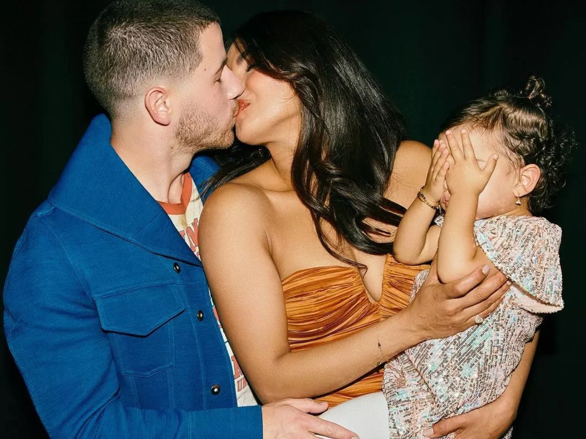 Playful birthday kiss