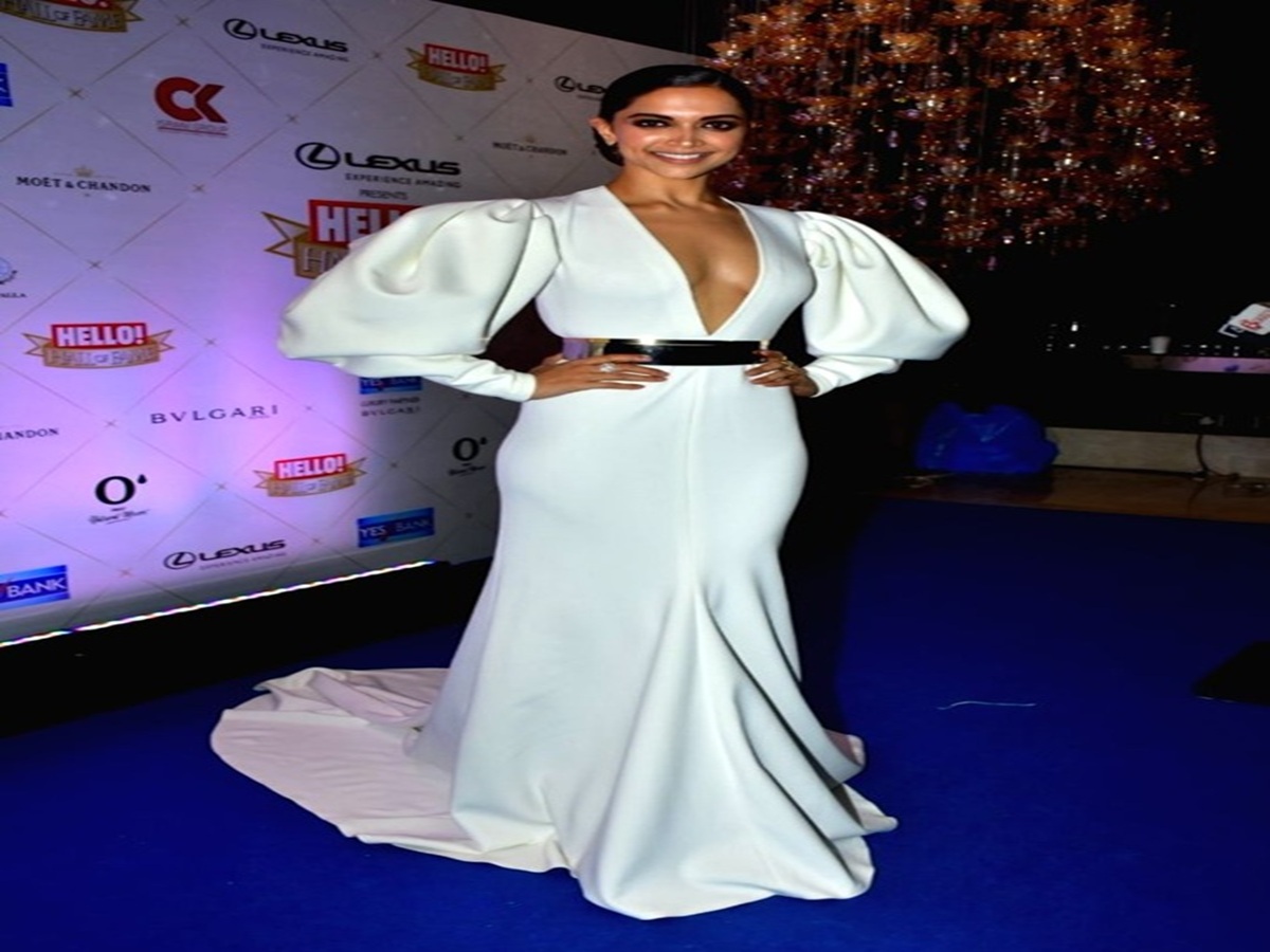 Deepika Padukone in a white gown with Ranveer Singh in a navy suit at Hello! Hall of Fame Awards 2018 red carpet