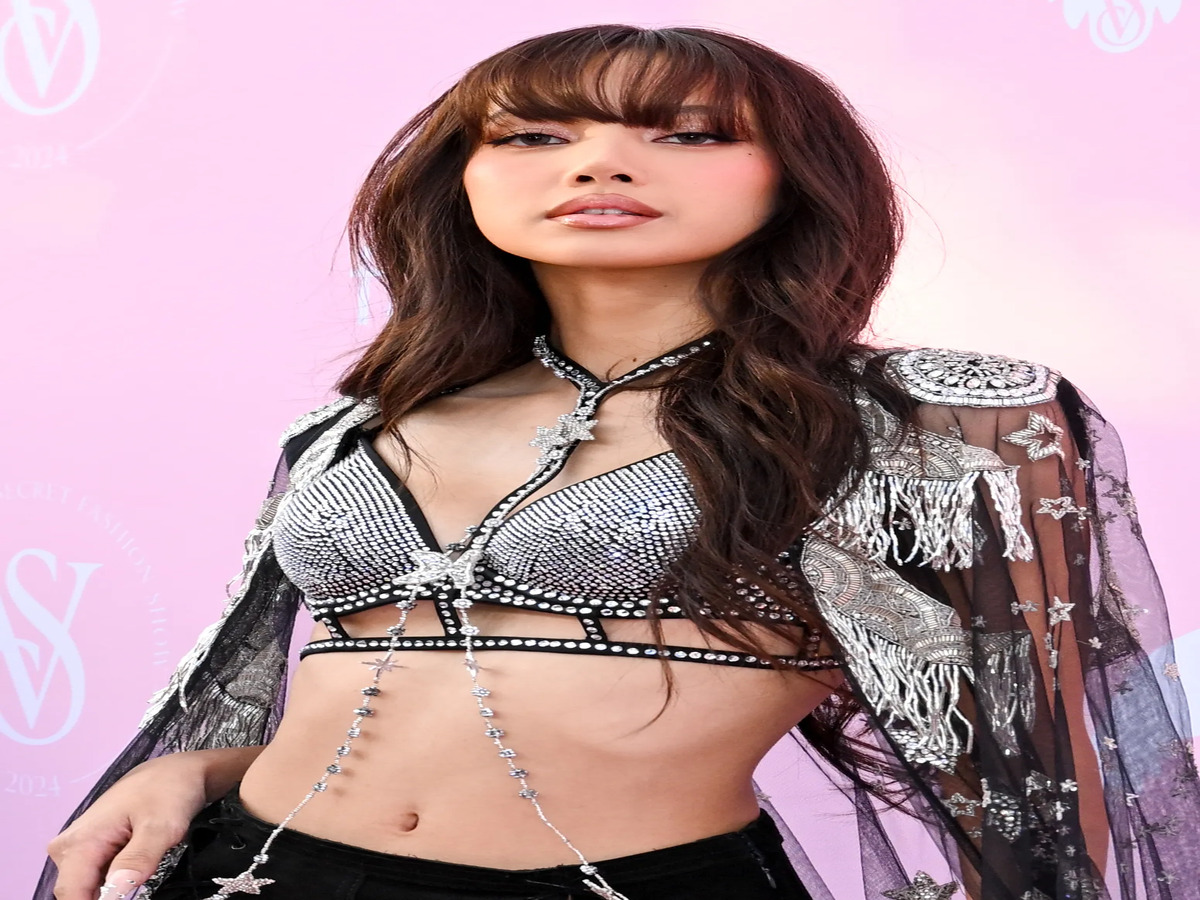 Lisa from Blackpink wearing a Louis Vuitton logo bikini, which has sparked debate over the appeal of flashy designer swimwear versus more minimalist styles.