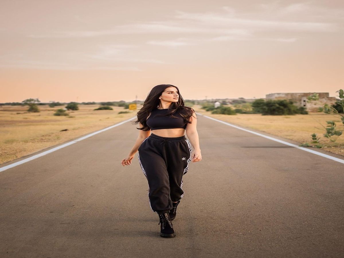Tara Sutaria wearing an all-black athleisure outfit, radiating style and confidence
