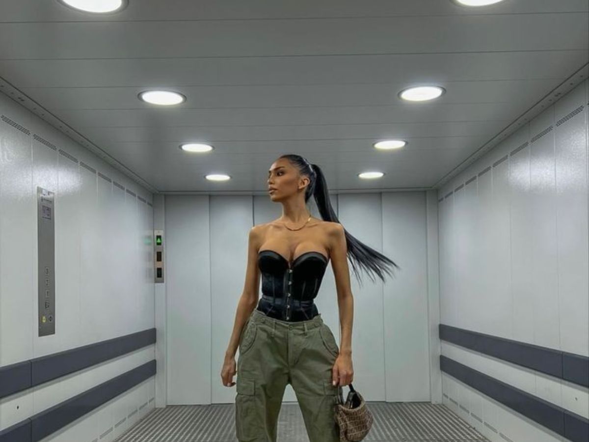 Sleek low ponytail with cargo pants