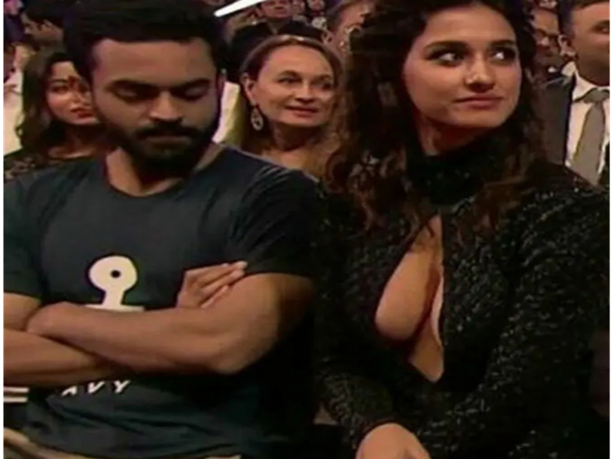 Disha Patani adjusting her outfit after a wardrobe glitch during a public event