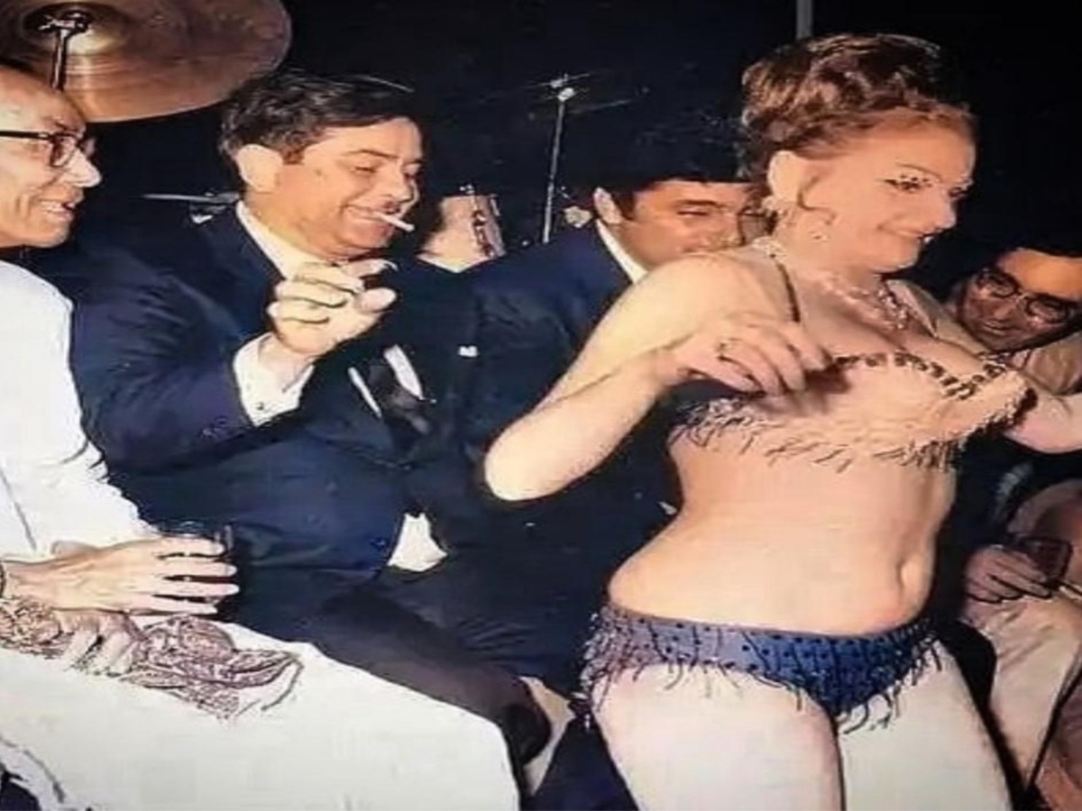 A striking scene from a Bollywood party, reflecting the glamorous setting alongside the whispers of casual and illicit sexual encounters among attendees.