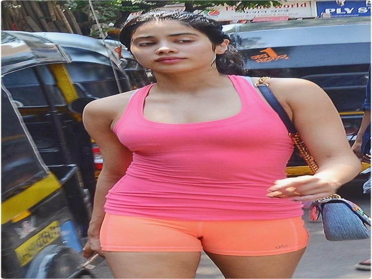 Jahnvi Kapoor in a pink and orange gym outfit.