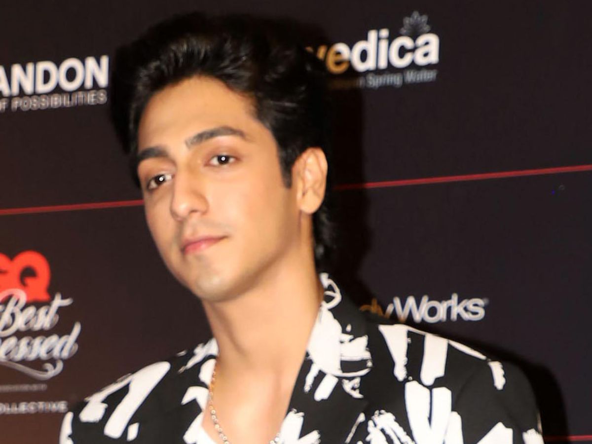 Ahaan Panday in a black and white shirt at a Bollywood event