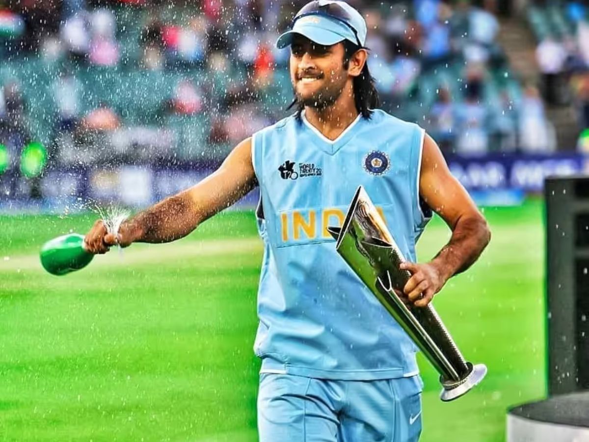 MS Dhoni holding 2007 T20 World Cup trophy with teammates celebrating