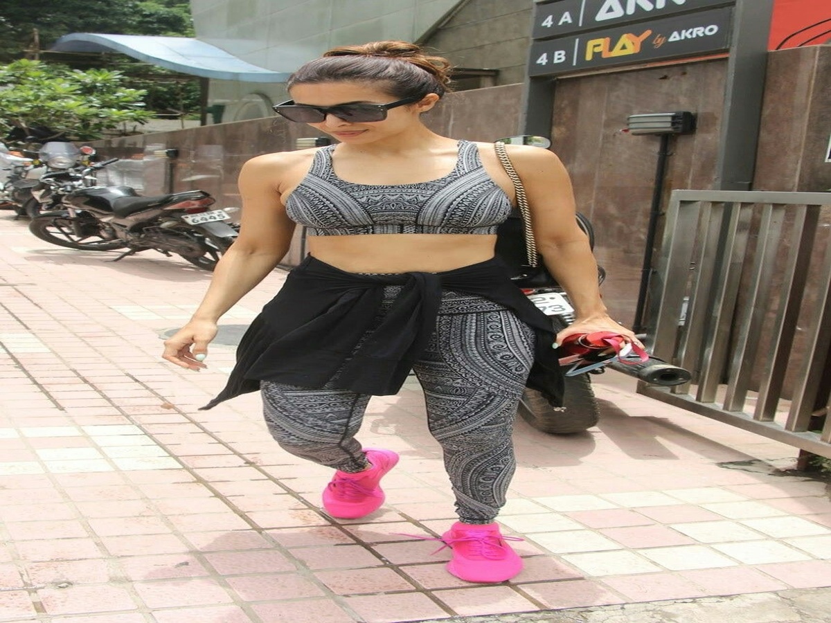 Malaika Arora in a fashionable black and white gym outfit.