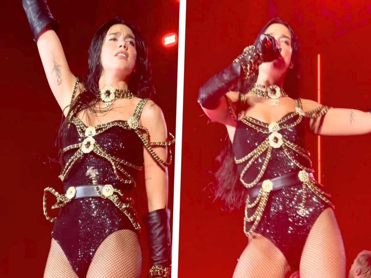 Dua Lipa in a black Chanel bodysuit with gold chains.