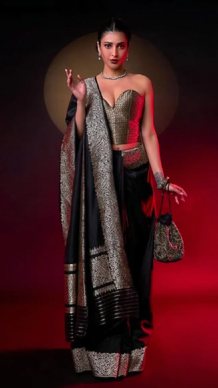 An elegant representation of traditional attire, showcasing a stunning saree and embellished blouse, exuding confidence and grace.