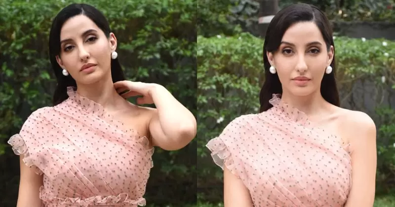 Nora in a blush pink tulle midi dress