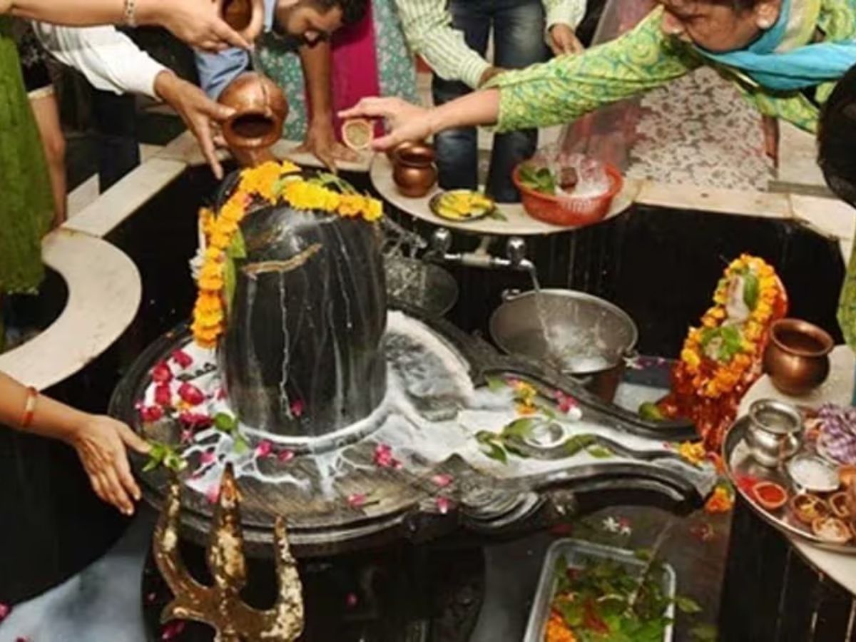 Milk and water being poured on Shiva Linga during Shivratri puja.