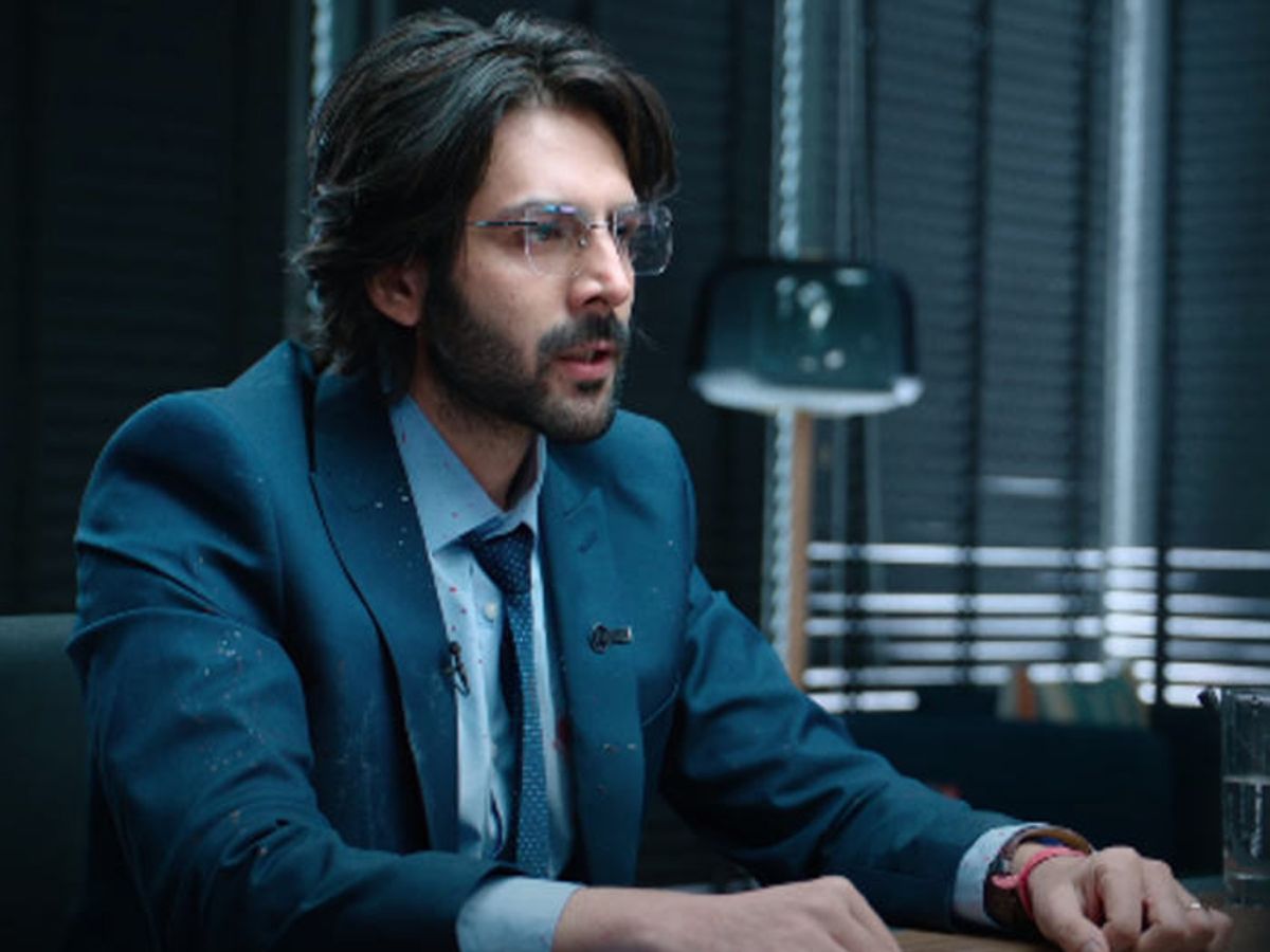 Kartik Aaryan in a tense moment behind a news desk in Dhamaka
