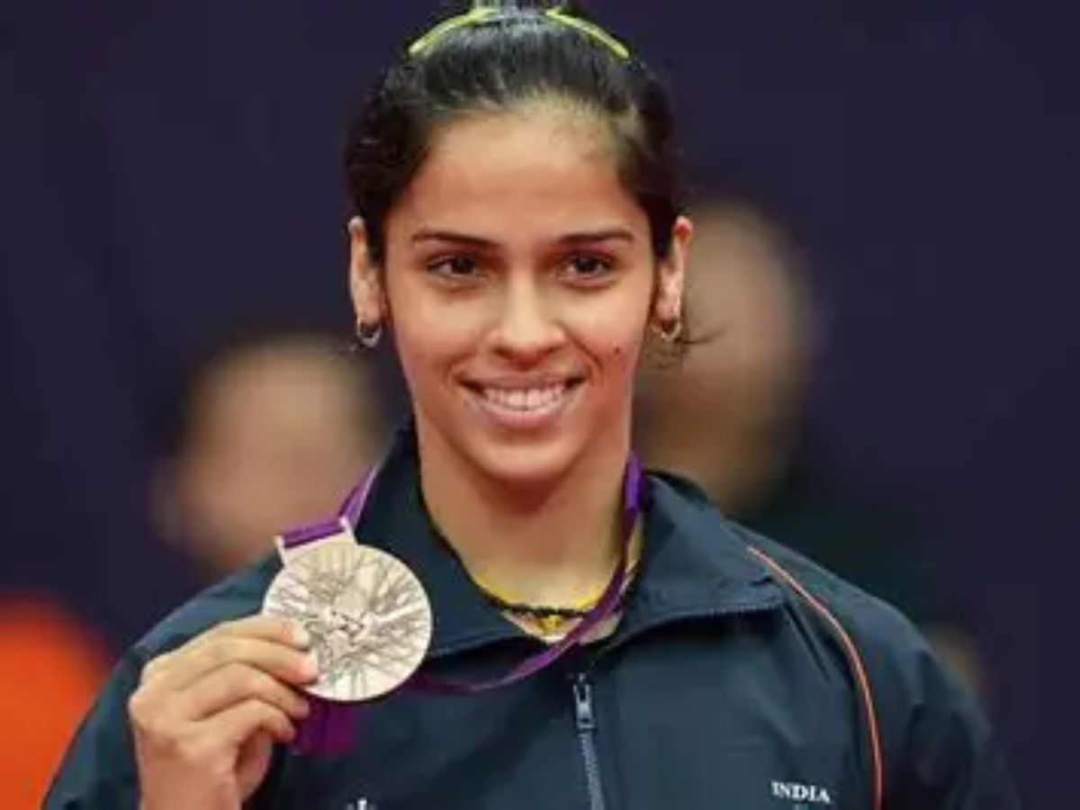 : Saina Nehwal holding her 2012 Olympic bronze medal