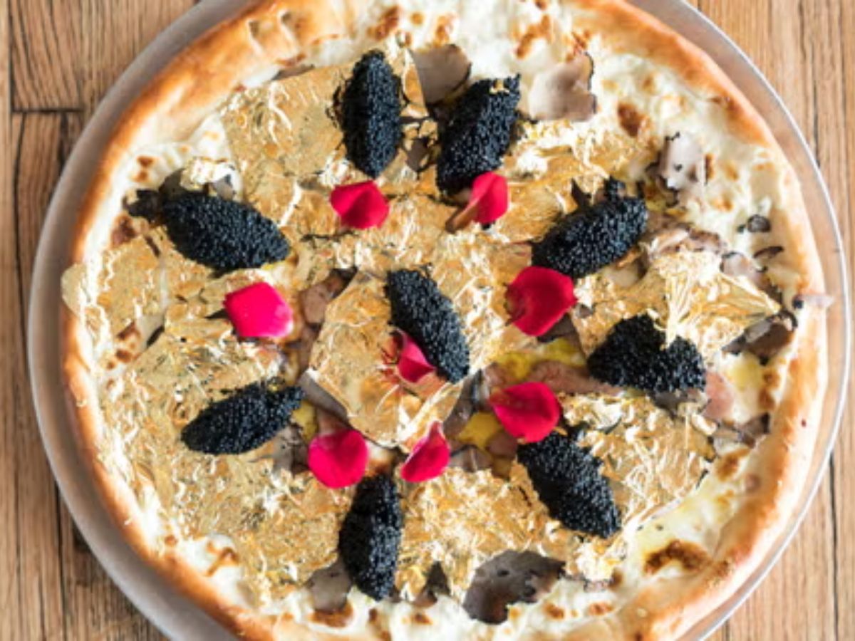 Gourmet pizza with caviar and gold flakes at Leela Palace Delhi