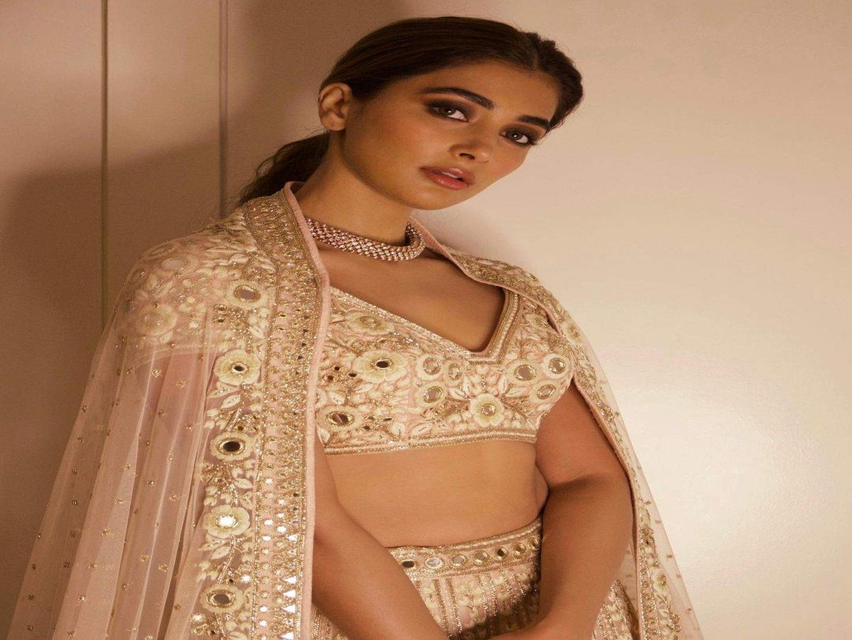 Pooja Hegde in an embroidered lehenga by Arpita Mehta.