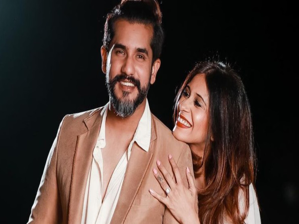 Kishwer Merchant kissing Suyyash Rai on a boat, capturing a romantic moment that exemplifies their love and connection.