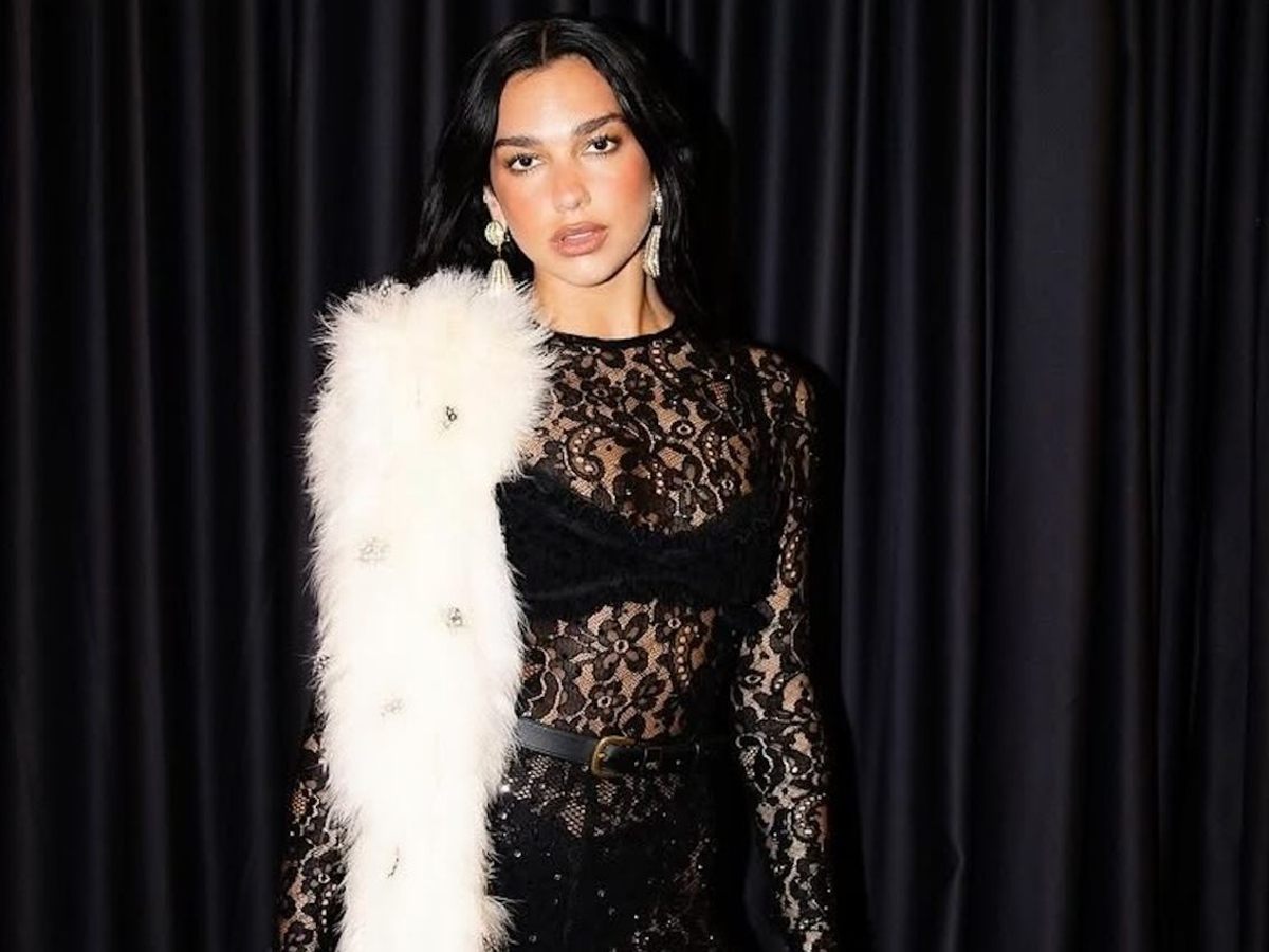 Dua Lipa in a custom lace catsuit by Valentino.