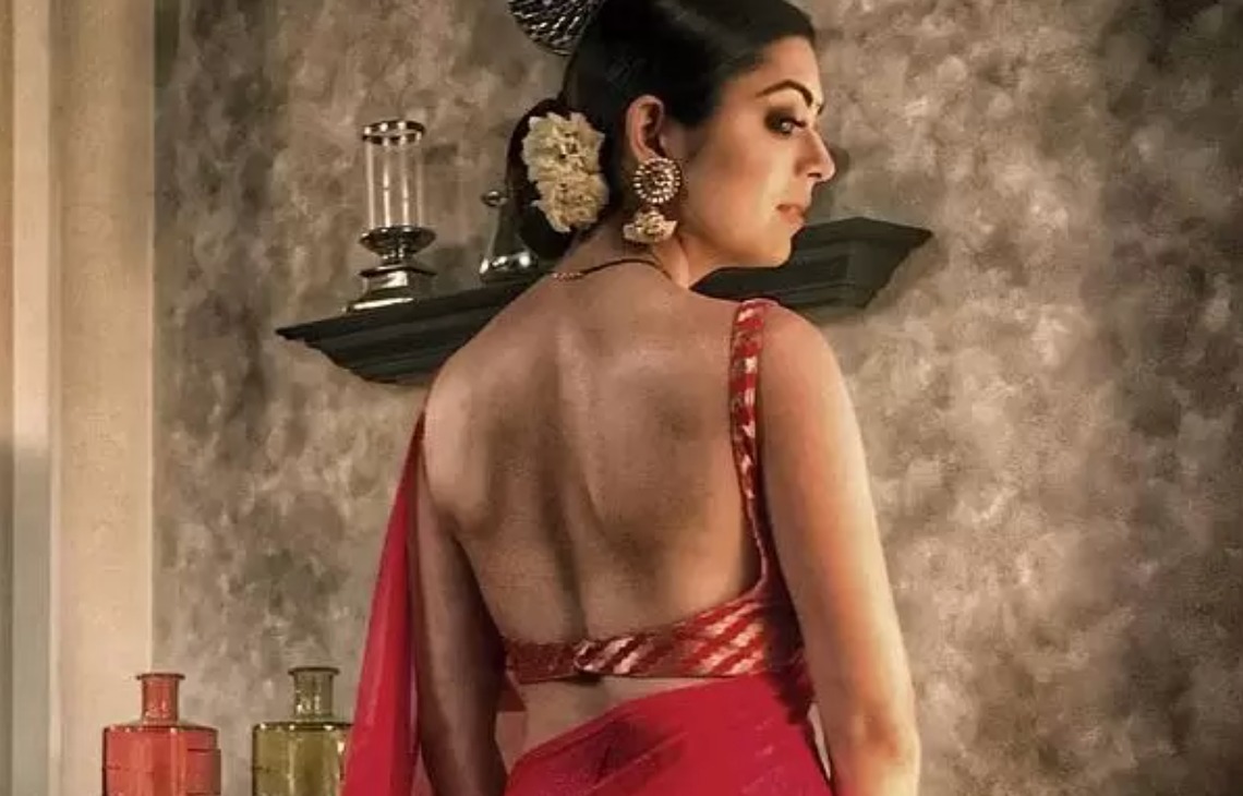 Drashti Dhami in a stunning red saree, looking gorgeous.