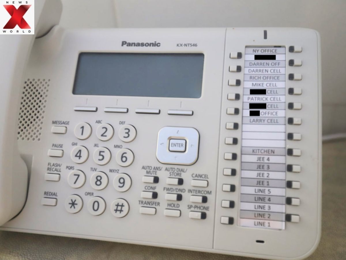 A telephone with handwritten speed-dial notes