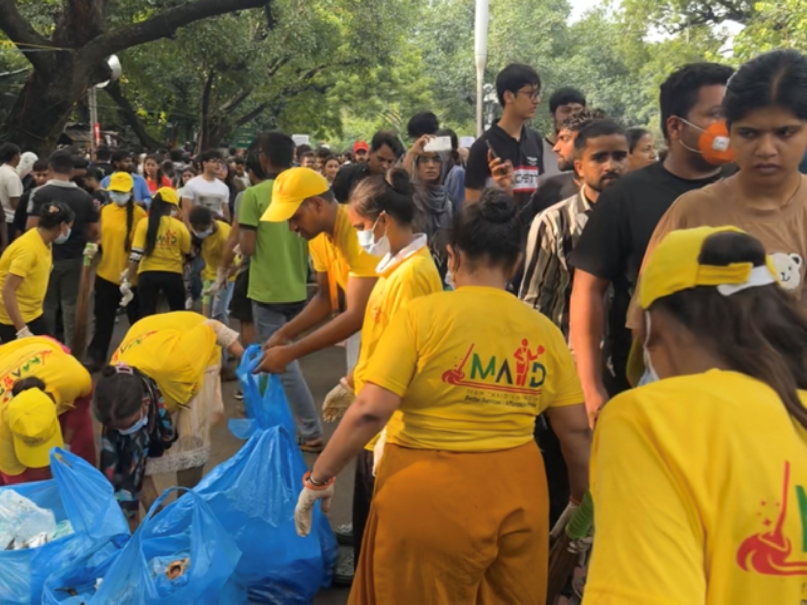 maid-in-india-leads-cleanliness-drive-at-delhi-protest-site-yellow-t-shirts-blue-bags-one-mission20260722162313 Maid In India Leads Cleanliness Drive at Delhi Protest Site. Yellow T-Shirts, Blue Bags, One Mission